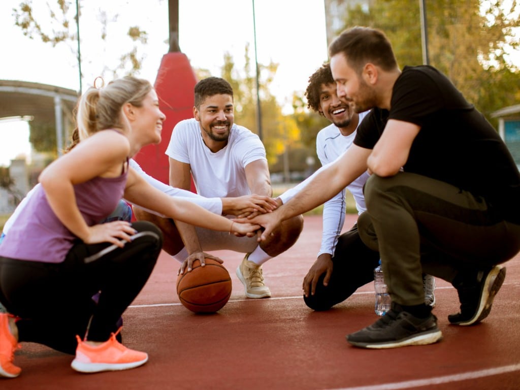 multiethnic group basketball players resting-court