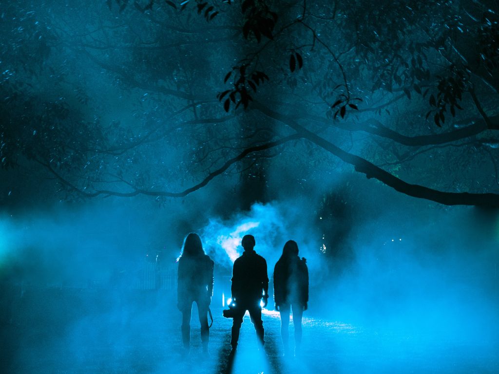 spooky people standing field night
